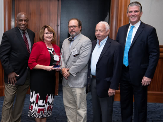 Director Beavers accepting award